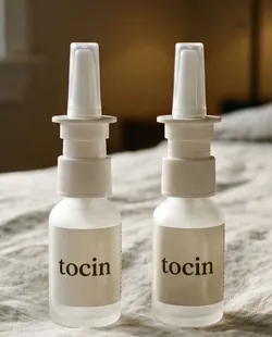 Two Tocin nasal spray bottles